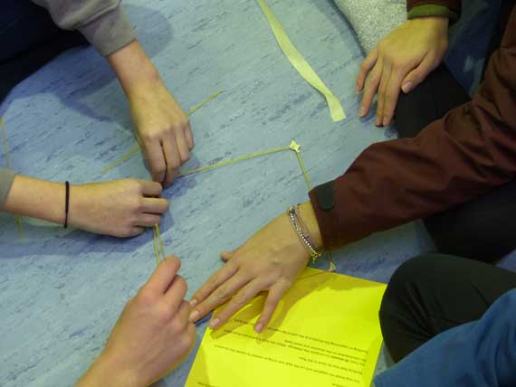 Group of teenagers solves a task