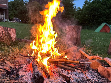 Spending time around the camp fire with other women