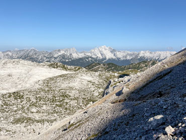 Panoramic view of rugged limestone terrain and mountain peaks in Slovenia's Julian Alps